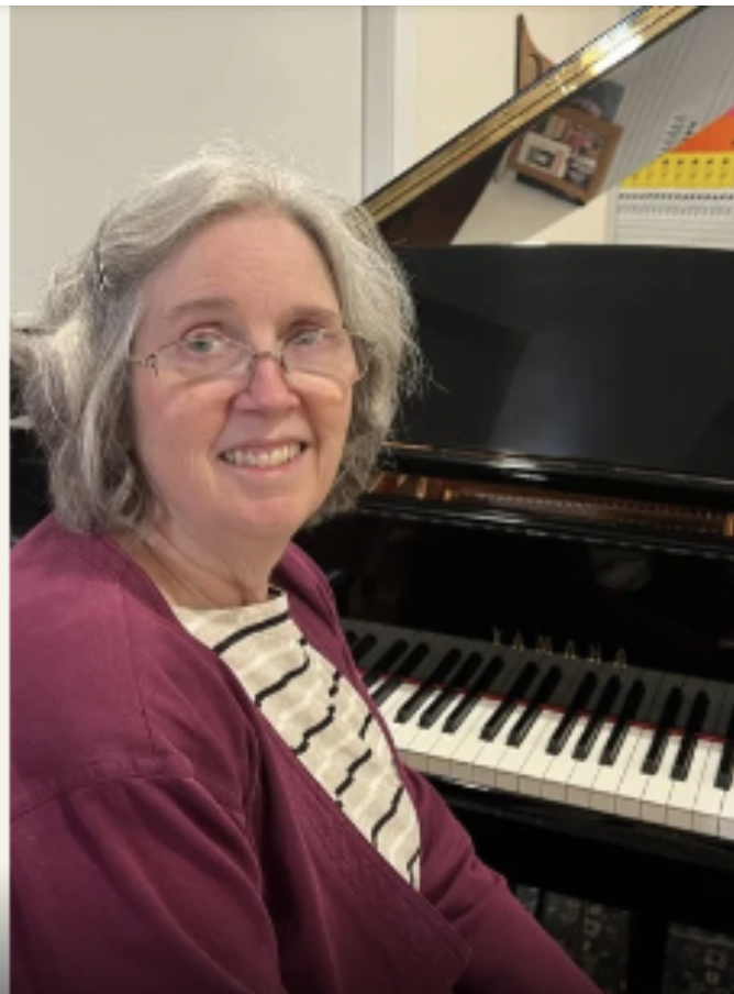 Karen Monroe at the piano — learn music theory at any age.
